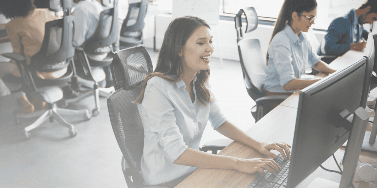 Woman looking at a computer in an office